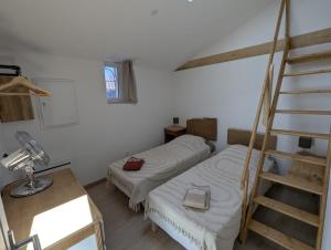 En eller flere senge i et værelse på Entre cuves et sources - au coeur de Goudargues