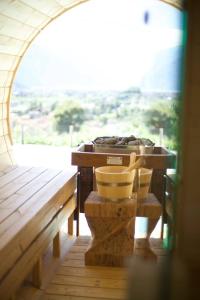 a table and chairs in a room with a window at Agriturismo Maso le 4 stagioni in Arco