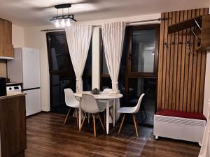 a kitchen with a table and chairs in a room at Green Agarak 2 near Dendropark, Stepanavan in Gyulagarak