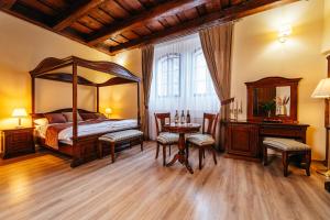 Postel nebo postele na pokoji v ubytování Knížecí apartmány Regent