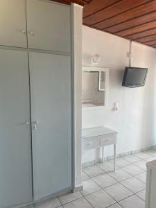 A kitchen or kitchenette at Agnàntema Portside Stays Skiathos