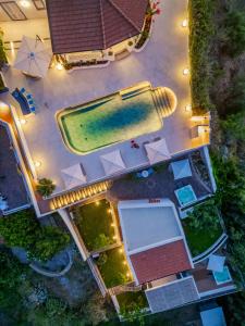 an overhead view of a swimming pool at a resort at Dolceterra Eolian Villas in Lipari