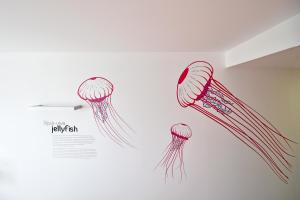 two drawings of jellyfish hanging on a wall at Casa da Baía - Guest House in Horta