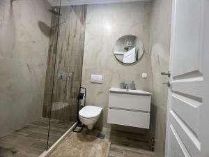 a bathroom with a shower and a toilet and a sink at Apartments San with Sea View in Dobra Voda +52 photos