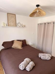 Ένα ή περισσότερα κρεβάτια σε δωμάτιο στο Appartement