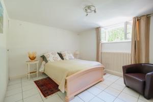 Ένα ή περισσότερα κρεβάτια σε δωμάτιο στο Charmant Appartement De Plein Pied