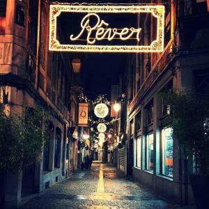 an empty street at night with a sign that reads fear at 302 Le Spot Neuvice in Liège +1 photo