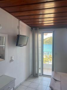 A television and/or entertainment centre at Agnàntema Portside Stays Skiathos
