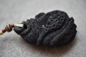 a black object sitting on top of a table at Casa da Baía - Guest House in Horta