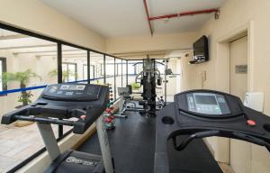 a gym with two treadmills and a treadmill at Transamerica Executive Bela Cintra (Paulista) in Sao Paulo