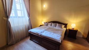 Postel nebo postele na pokoji v ubytování Knížecí apartmány Regent
