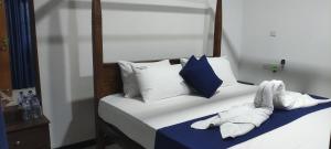 Postel nebo postele na pokoji v ubytování Oleena Home Stay