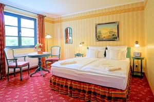 Postel nebo postele na pokoji v ubytování Hotel Godewind