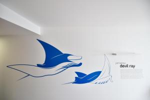two birds flying in the sky illustration at Casa da Baía - Guest House in Horta