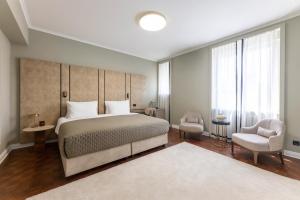 Postel nebo postele na pokoji v ubytování Hotel Majestic