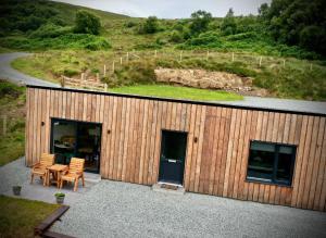 an overhead view of a building with a table and chairs at Luxury One Bedroom Cabin - Heatherbank Cabin in Portree