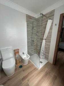 a bathroom with a shower and a toilet and a sink at Bahamas Avenida Muelle in Puerto de la Cruz +15 photos