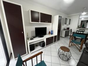 Televisyen dan/atau pusat hiburan di Villa Mar Piscina e Sauna Praia da Areia Preta