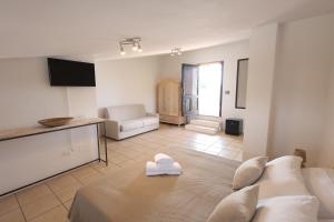a living room with a couch and a table at Agriturismo Pietragrande in Otranto