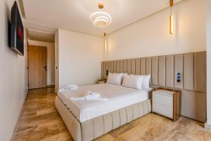 Ένα ή περισσότερα κρεβάτια σε δωμάτιο στο 1 Ch, 1 SDB et Parking gratuit au Centre de Gueliz avec vue