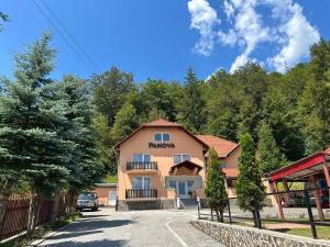 a building with a sign that says monday on it at Vila Panova in Borsec