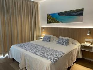 Letto o letti in una camera di Hotel Sultán