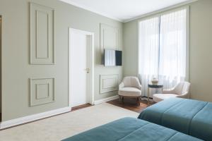 TV a/nebo společenská místnost v ubytování Hotel Majestic