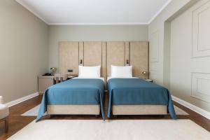 Postel nebo postele na pokoji v ubytování Hotel Majestic