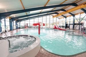 a large swimming pool with a water slide at The Ocean Nook in New Quay