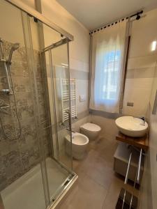 a bathroom with a shower and a toilet and a sink at La Graziosa in Arezzo