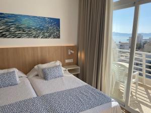 Letto o letti in una camera di Hotel Sultán