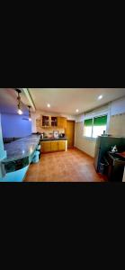 a large kitchen with a counter top in a room at Souki in Marrakech