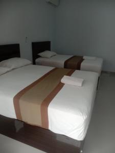 Postel nebo postele na pokoji v ubytování Taman Ratih Guest House