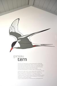 a page of a book with a drawing of a bird at Casa da Baía - Guest House in Horta