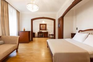 Postel nebo postele na pokoji v ubytování Hotel Majestic