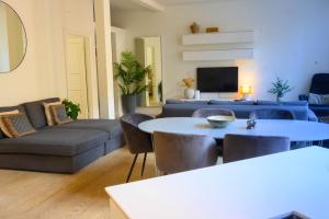 a living room with a couch and a table at Best Stay Copenhagen Apartment 1550 in Copenhagen