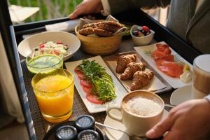 a table with a tray of food and drinks at Sant Francesc Hotel Singular in Palma de Mallorca