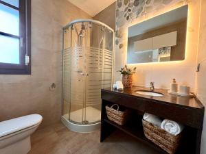 a bathroom with a shower and a sink and a toilet at inncadiz El Refugio de Gadir in Cádiz +12 photos