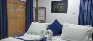 Postel nebo postele na pokoji v ubytování Oleena Home Stay