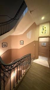 a staircase in a building with a stair case at HOTEL SYLVABELLE in Marseille