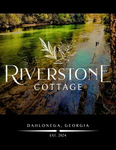 a sign that says riverstone cottage with a picture of a river at Riverstone Cottage A Cozy Riverfront Retreat in Dahlonega