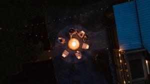 an overhead view of a table and chairs at night at Riverstone Cottage A Cozy Riverfront Retreat in Dahlonega