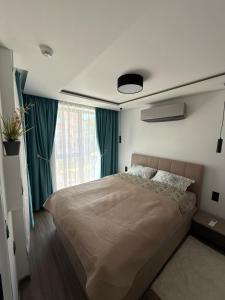 a bedroom with a large bed and a window at Sea Home 9 in Sunny Beach +58 photos