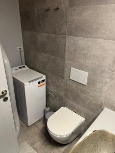 a small bathroom with a toilet and a sink at La Casa Bianca Naxos in Vívlos +36 photos