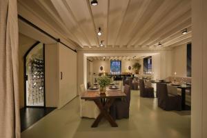 a large dining room with a table and chairs at Sant Francesc Hotel Singular in Palma de Mallorca