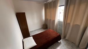 Ένα ή περισσότερα κρεβάτια σε δωμάτιο στο Apartamento com 2 quartos