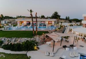 an aerial view of a resort with a swimming pool at The Palms Concept Hotel Adults Only 16 Plus in Faliraki