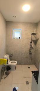 a bathroom with a toilet and a window at ZEYD VillA in Gabala