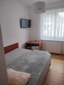 Pokoje Gościnne u Oli客房内的一张或多张床位