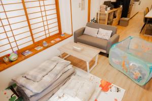 Postel nebo postele na pokoji v ubytování Okinawa Homie Stay + 47 fotografií